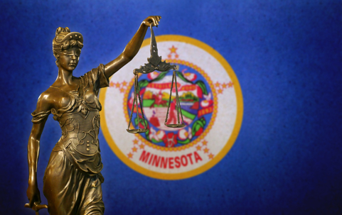 Lady Justice and Minnesota flag