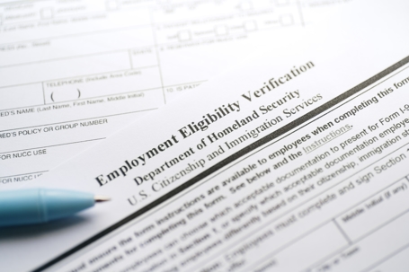 Employment Eligibility Verification form and pen