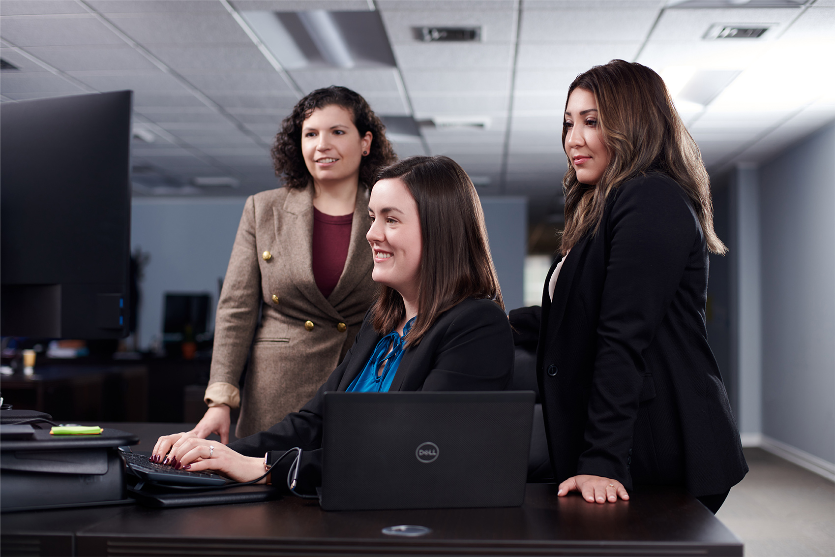 3 Female Attorneys Looking at a Computer 